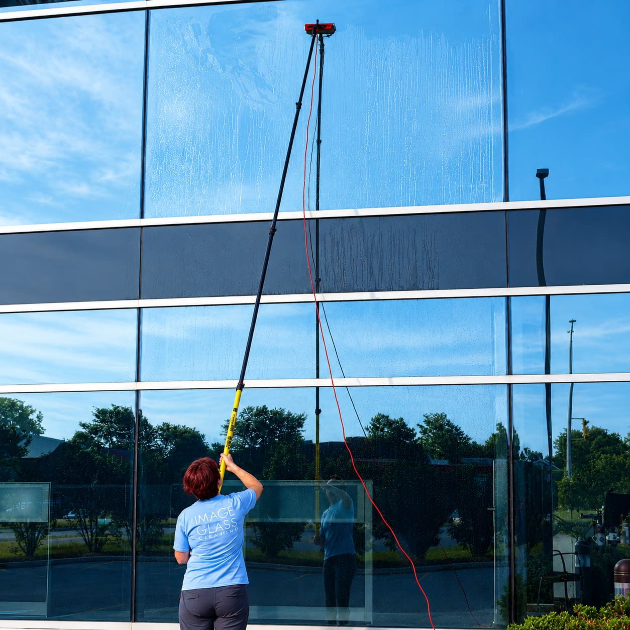 commercial window cleaning with water-feed poles